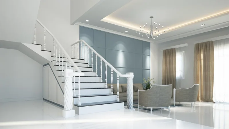 Intérieur clair avec escalier et murs décorés